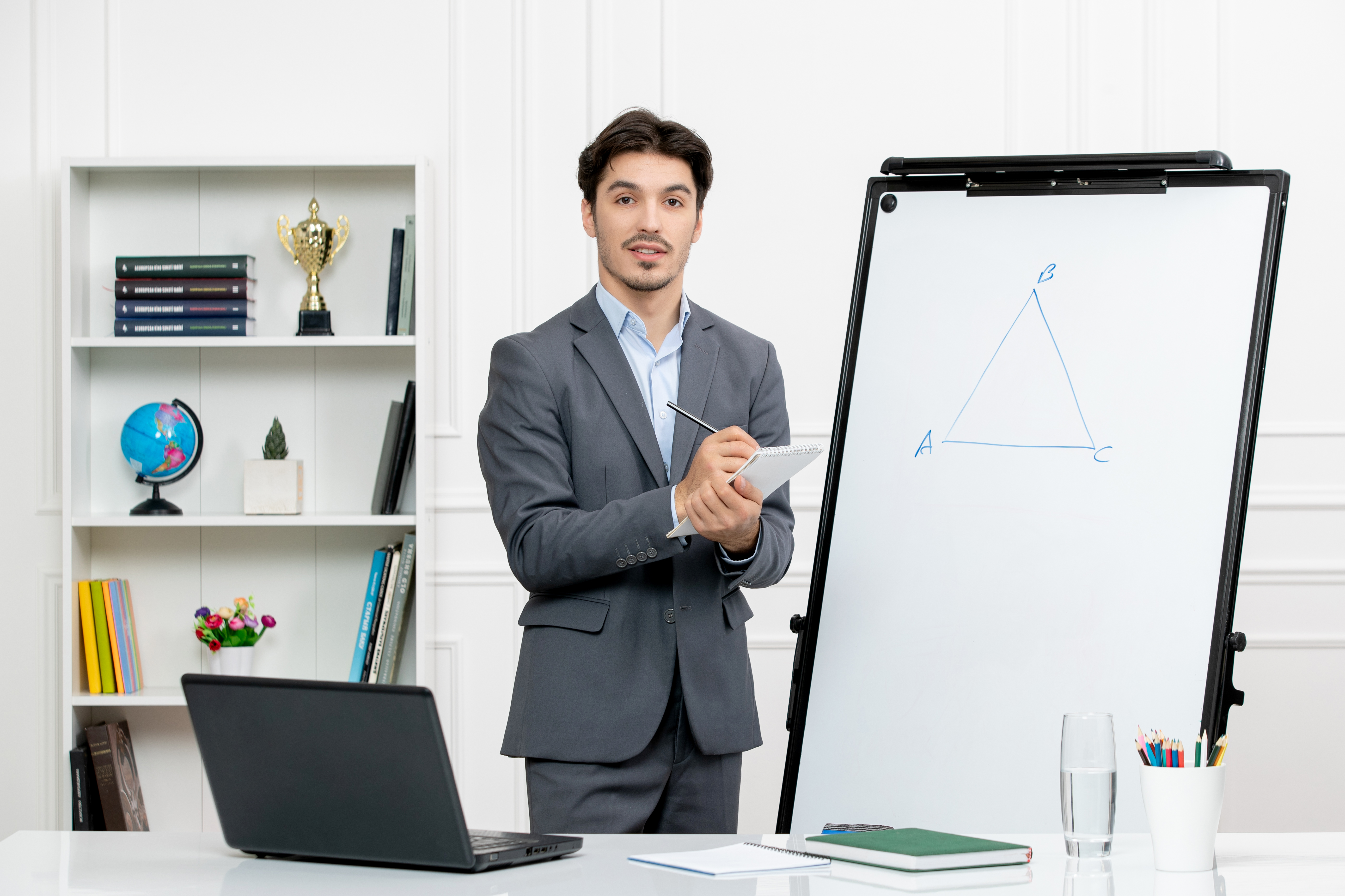teacher-young-instructor-office-suit-class-with-computer-whiteboard-writing-notes